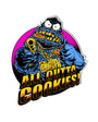 Blue furry monster sticker with gold chain, gun, and "ALL OUTTA COOKIES!" text, 3"x4" gloss finish.