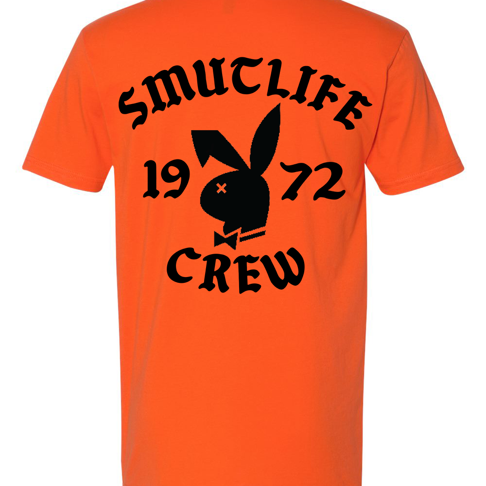 Men's tangerine cotton t-shirt with black "SMUTLIFE 1972 CREW" text and bunny logo.