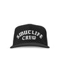 Black SMUTLIFE CREW 1972 snapback hat with white embroidered text, flat bill, and structured high-profile design.