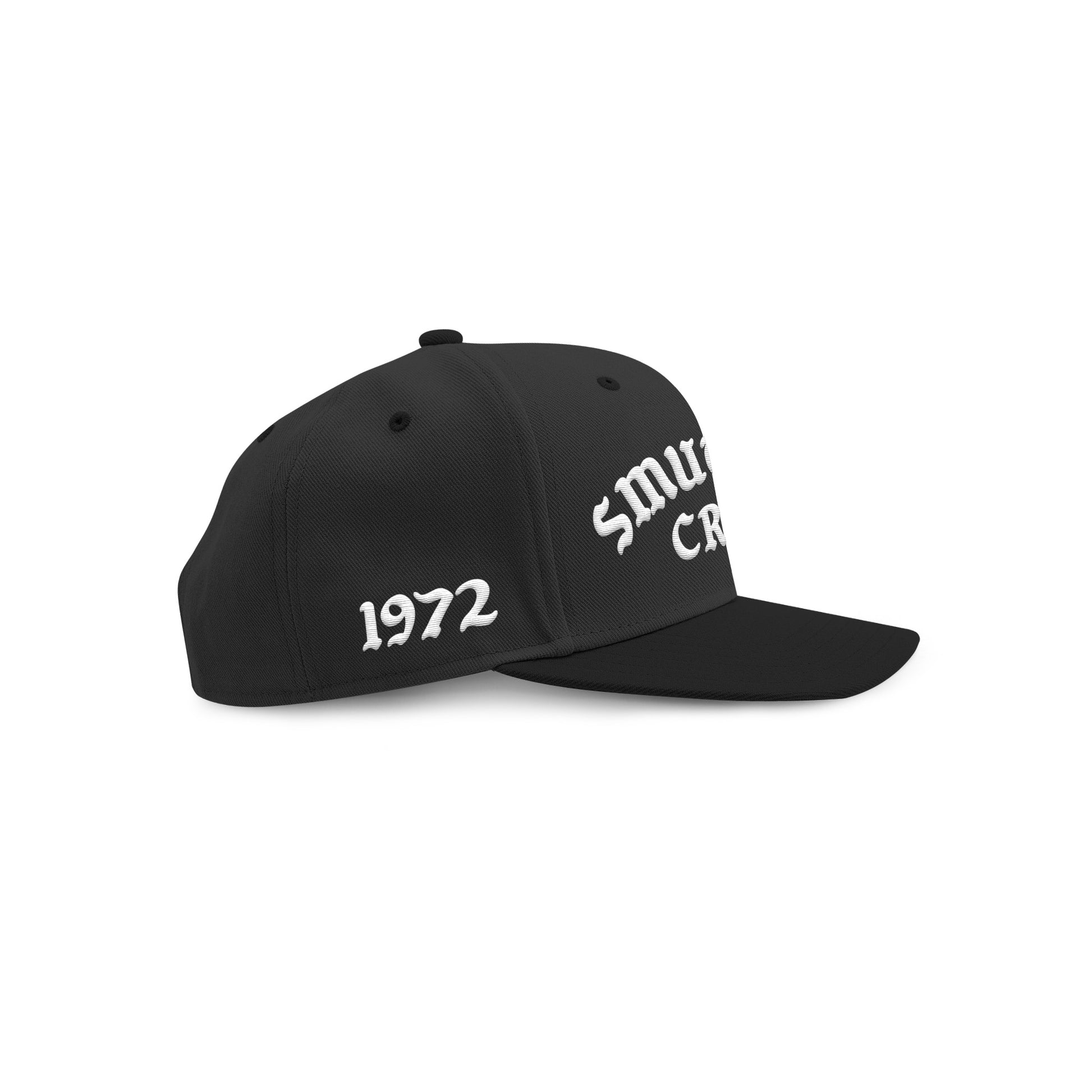 Black SMUTLIFE CREW 1972 snapback hat with white embroidered text on front and "1972" on left panel.