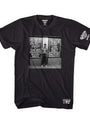 Black unisex cotton t-shirt with "LIVE AT THE PEEP SHOW N.Y.C." graphic featuring a man in front of neon signs.