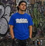 Man wearing a Dodger Blue Smutlife "THROWIE" T-shirt with white graffiti text, black cap, and paint-splattered shorts.