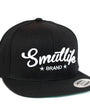 Black Smutlife Brand Tri-Star flatbrim snapback baseball hat with white embroidered logo.