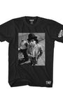Black Smutlife men's combed cotton t-shirt with a black and white print of Hervé Villechaize, "Tattoo," by a fire hydrant.