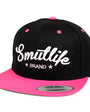 Black & pink Smutlife Brand snapback baseball hat with white embroidered logo and tri-stars.