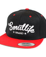 Black and red Smutlife Brand flatbrim snapback baseball hat with white script logo.
