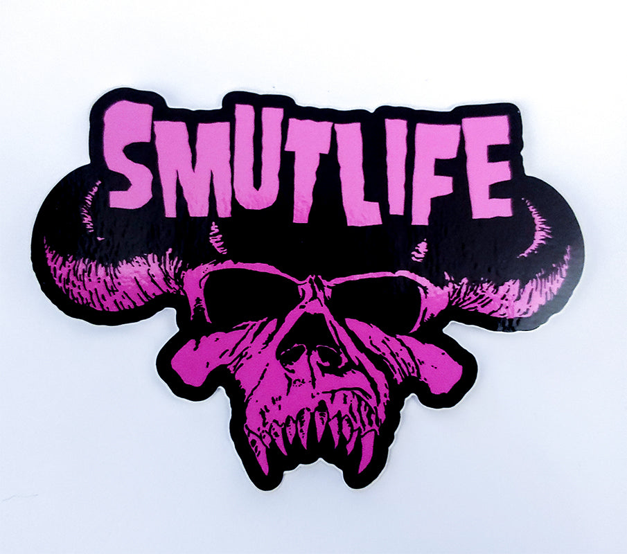 SMUTLIFE SKULL 3"x4" vinyl sticker with pink text and skull design on a black background.