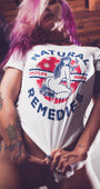 Woman in white SMUTLIFE Natural Remedies Boyfriend T-shirt with cannabis leaf heart design.
